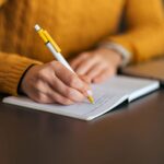 Writing in notebook. Close-up. | Hidalgo