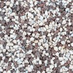 Close-up of small white and brown pebbles scattered on the ground.