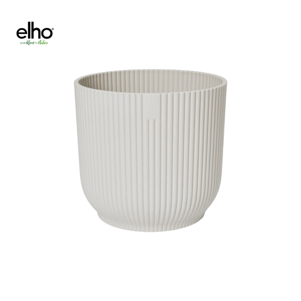 White ribbed plant pot with vertical grooves (empty) — by Elho into a modern cylindrical planter design, white ceramic-like finish.