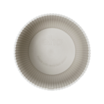 Top view of a circular, beige pleated paper cupcake liner for baking