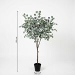 Artificial eucalyptus tree in a black pot, about 150 cm tall with a thin brown trunk and dense green leaves.