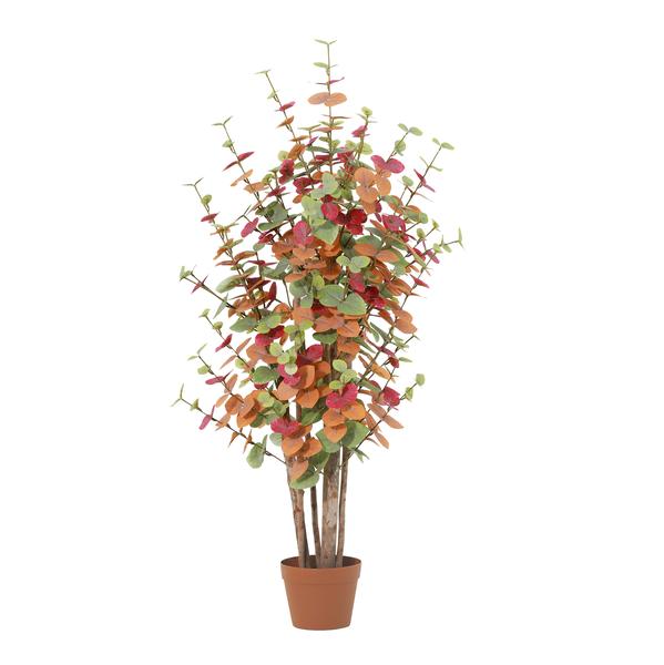 Artificial eucalyptus plant with multicolored leaves in a terracotta pot, decorative indoor plant.