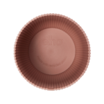 Pink circular fluted baking cup viewed from above, with the brand name 'echo' embossed on the center and note 'made with recycled plastic' around it