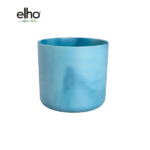 Blue cylindrical planter pot by Elho on a white background, empty and ready for plants.