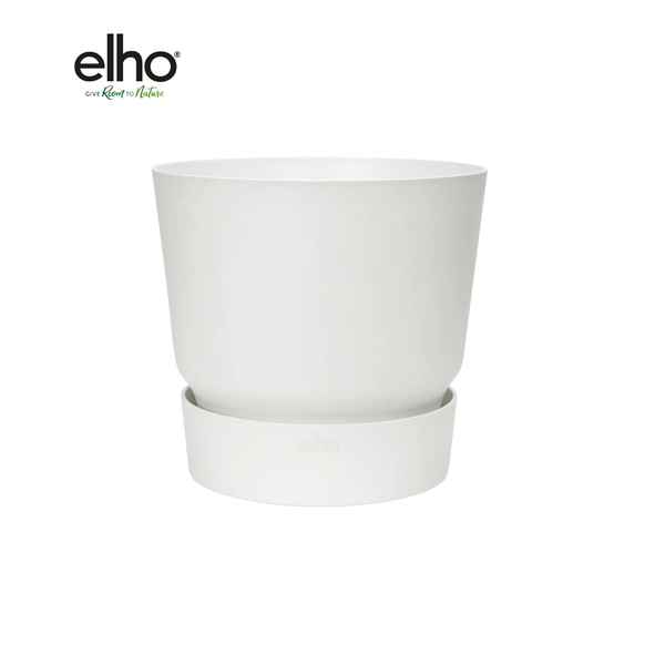White ceramic plant pot resting in a matching white saucer with subtle elho branding.