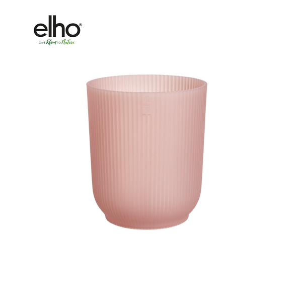 Pink ribbed planter by Elho on a white background, showcasing a soft pink color and vertical grooves.
