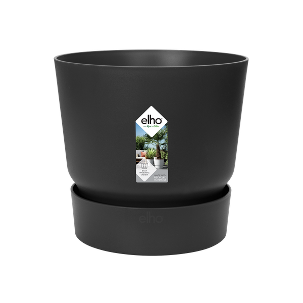 Black plastic plant pot on a matching saucer with the elho logo, suitable for indoor or outdoor plants.