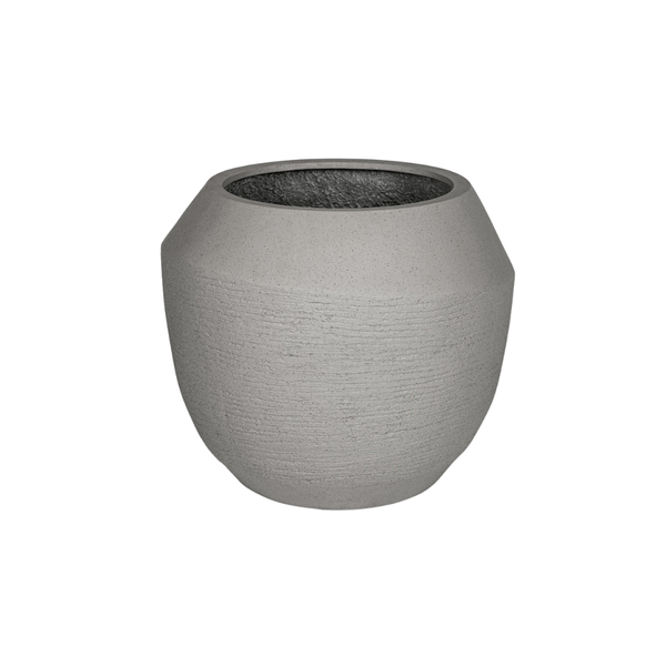 Grey textured concrete planter with a faceted rim, empty and ready for a plant.