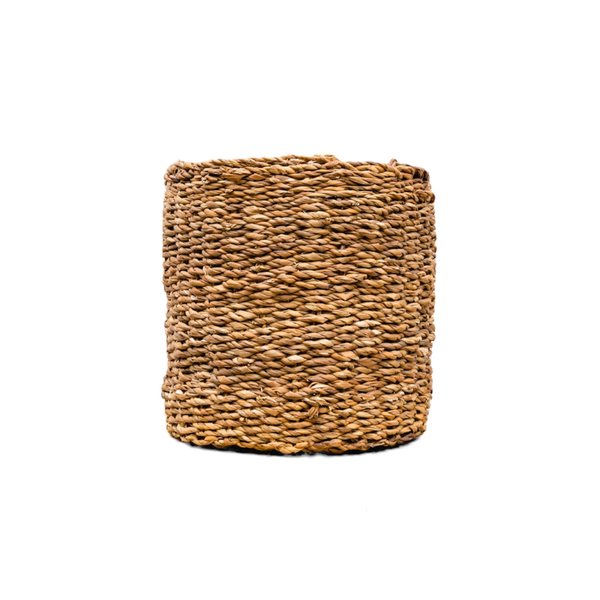 Cylindrical woven straw basket on a white background, natural brown tones and textured weave