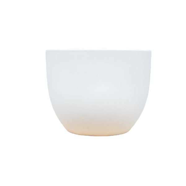 White ceramic cup with a soft beige gradient at the bottom, viewed from the side.