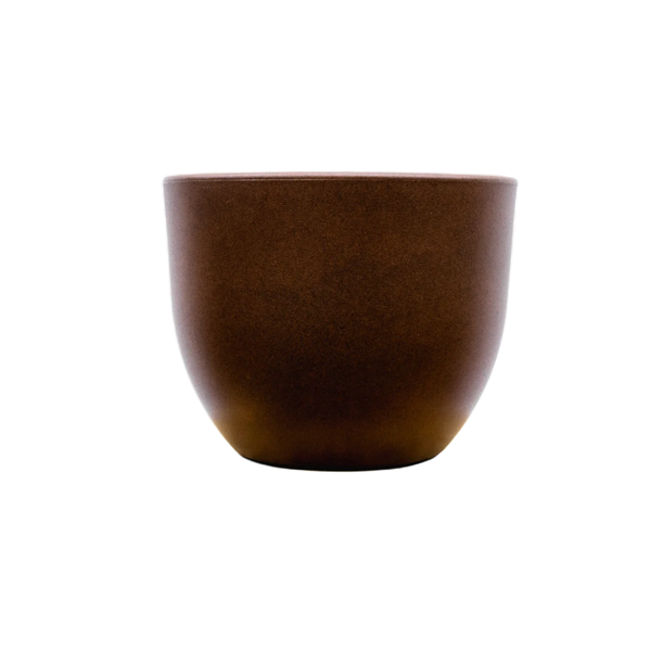 Brown ceramic cup with a rounded base on a white background.