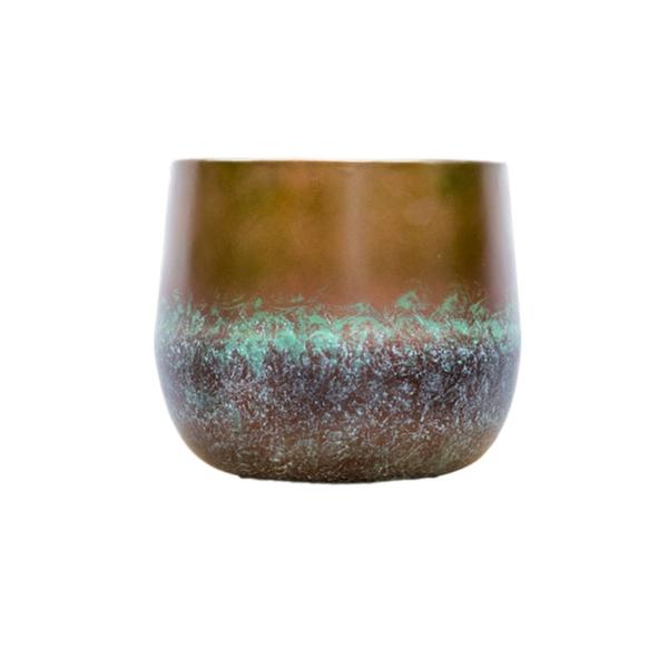 Ceramic cup with brown glaze on top, a turquoise band, and a dark textured base on a white background, photographed front-on.
