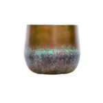 Ceramic cup with a brown glaze on top, green band in the middle, and a textured blue bottom.