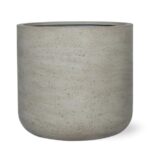 Concrete planter pot with a rounded base and speckled grey surface, empty and ready for planting.