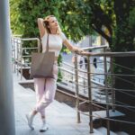 Young beautiful woman with linen eco bag on city background - Hidalgo