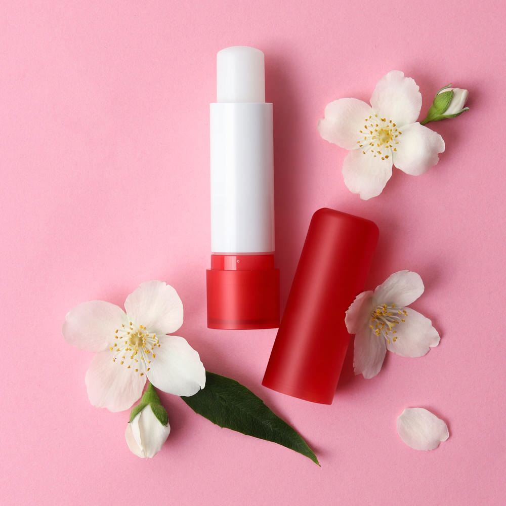 lip balm and flowers on a colored background close-up - Hidalgo