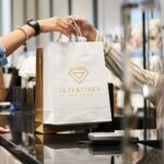 Shop Assistant Handing Purchases to Buyer - Hidalgo
