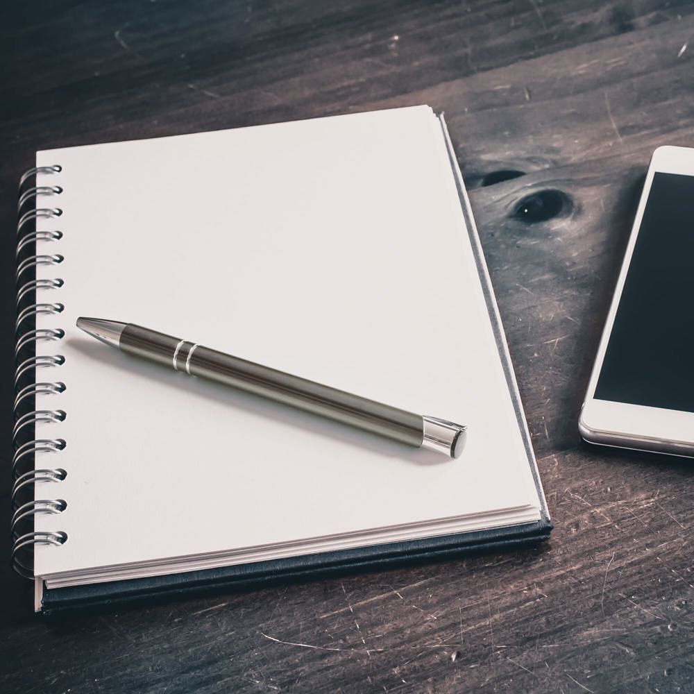 Pencil On A Blank Notebook Lying Next To A Business Smartphone On An Old Table - Hidalgo