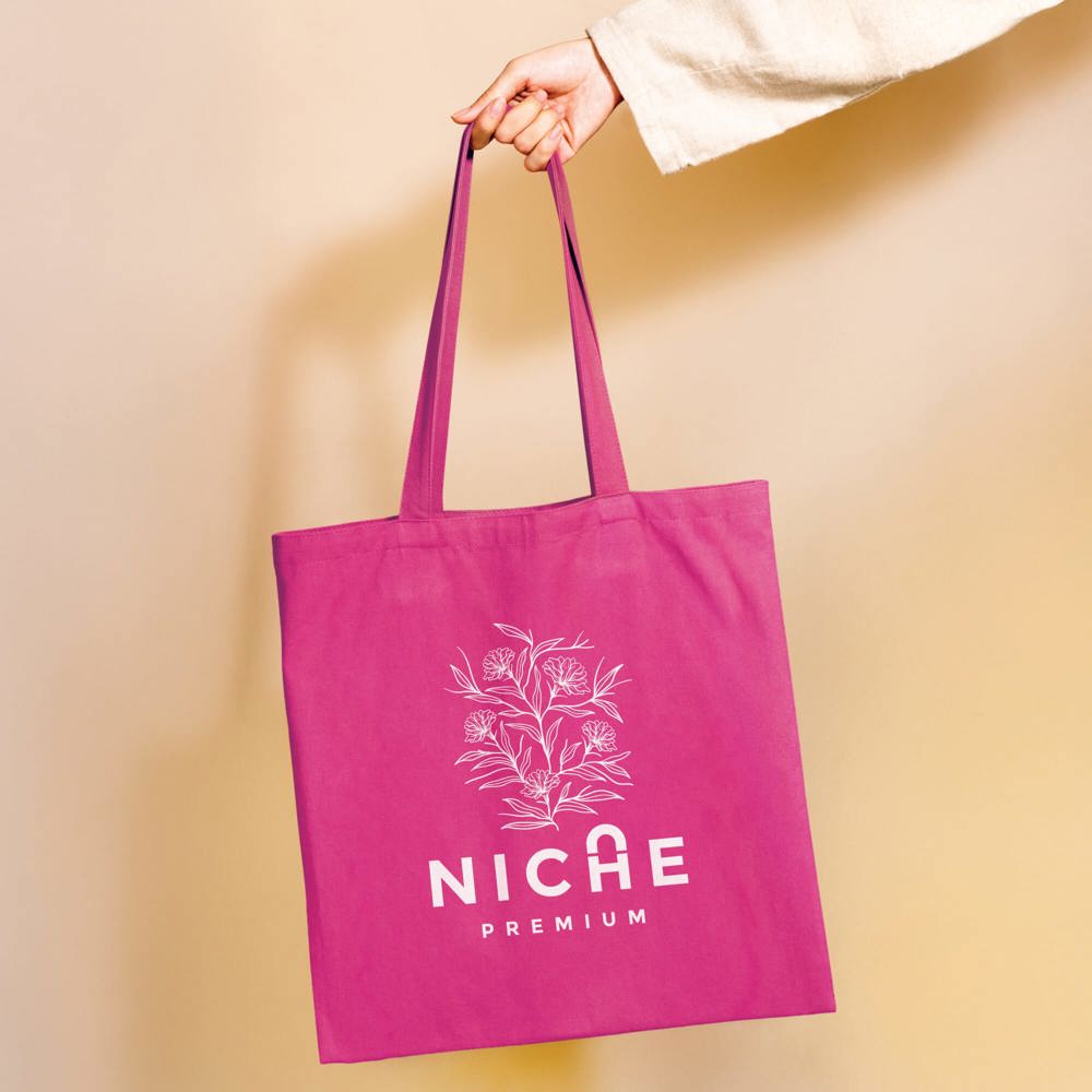 Woman holding a yellow tote bag in her hand - Hidalgo