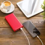 powerbank charging a smartphone - Hidalgo