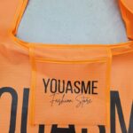 Opvouwbare boodschappentas opgevouwen in etui, oranje